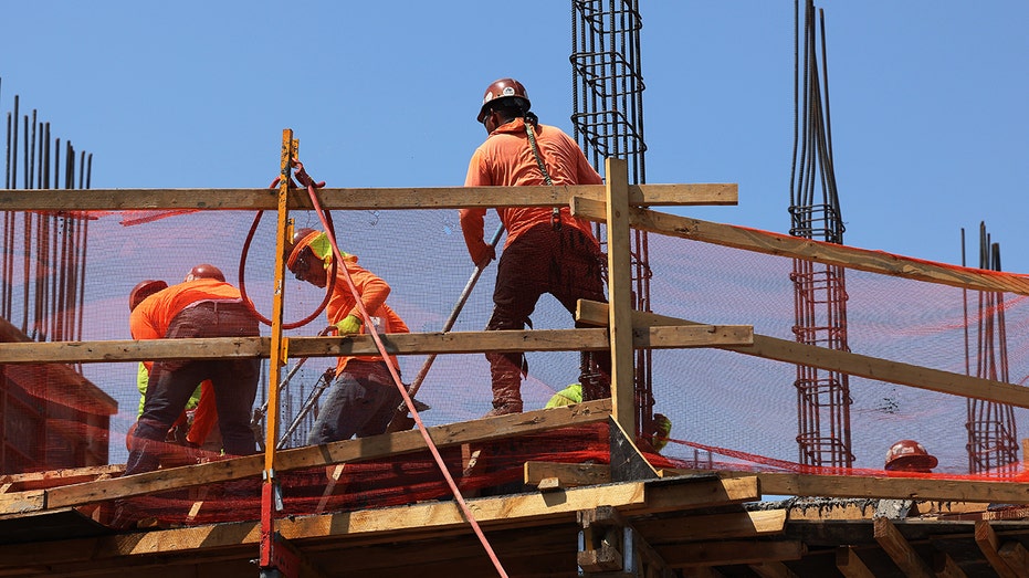 Construction workers work on a construction site