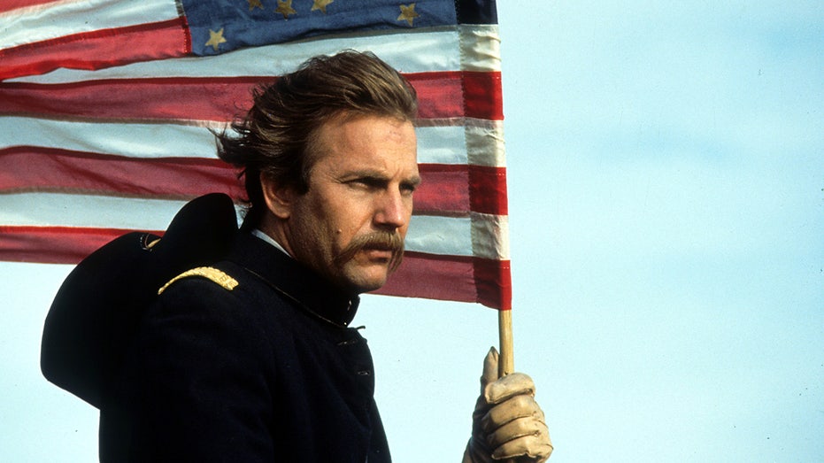 Kevin Costner holds flag in Dances With Wolves.