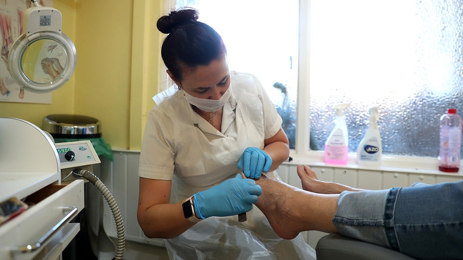 A podiatrist at work