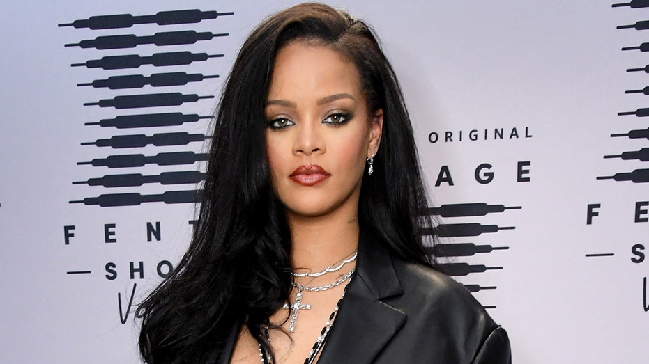 Rihanna walks Savage X Fenty red carpet in black leather blazer and lingerie