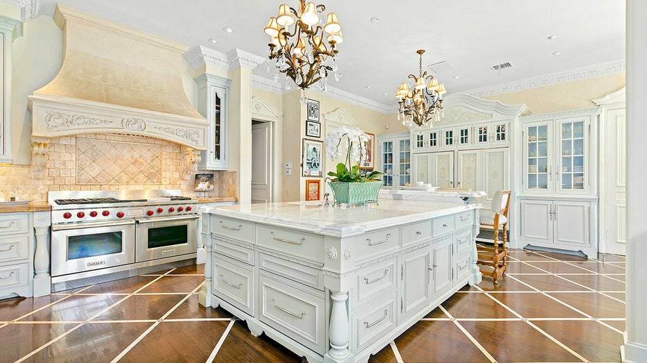 Rod Stewart's white kitchen features massive island