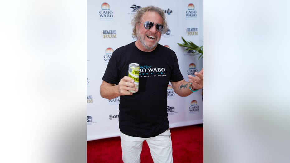 sammy hagar on red carpet holding can