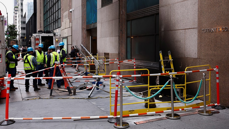 Consolidated Edison workers make repairs after an electrical fire at the recently renovated Tiffany flagship store on 5th Avenue in New York City