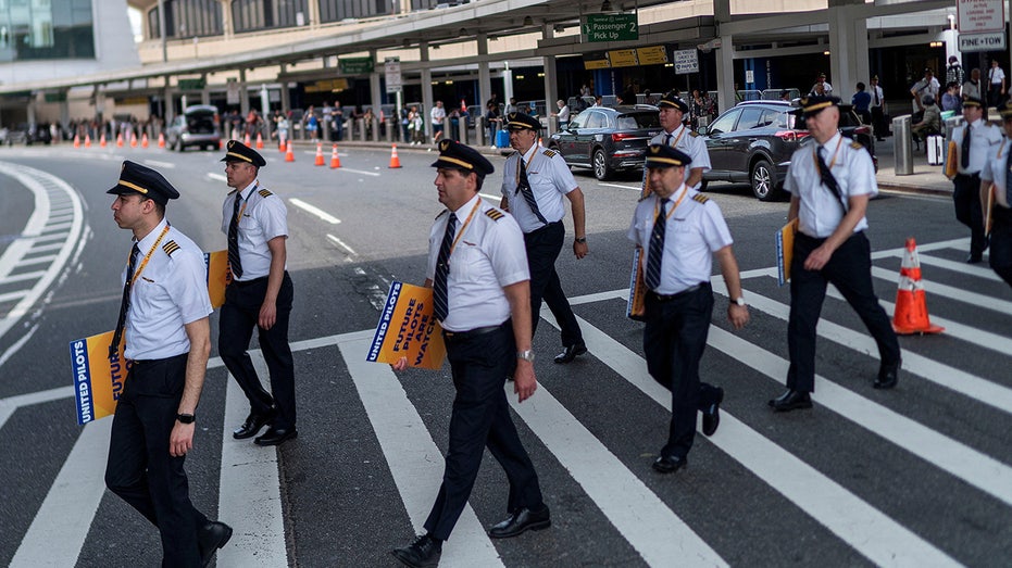 United Airlines pilots participate in an informational picket at Newark Liberty International Airport