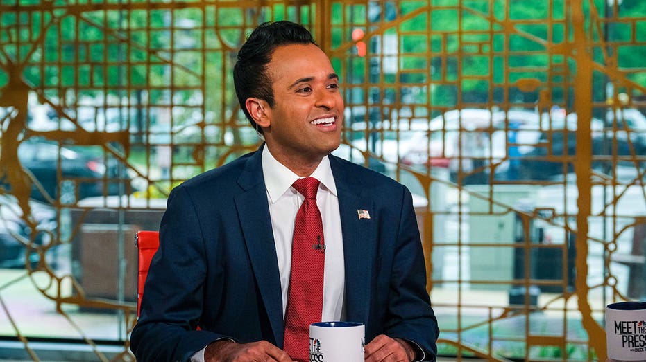 Vivek Ramaswamy smiles while sitting on the set of Meet the Press