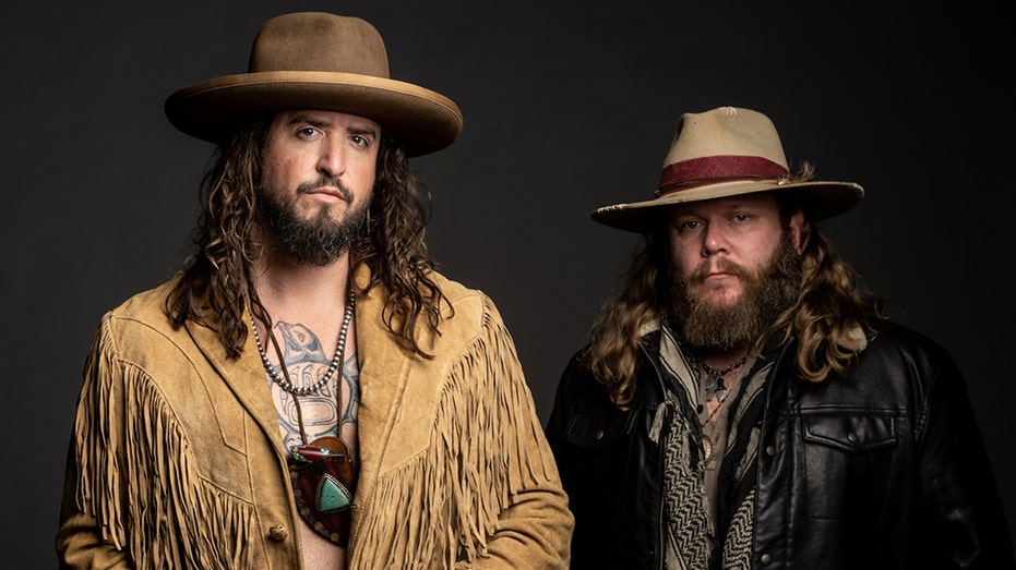 War Hippies duo Scooter Brown and Donnie Reis share stoic looks in country ensembles