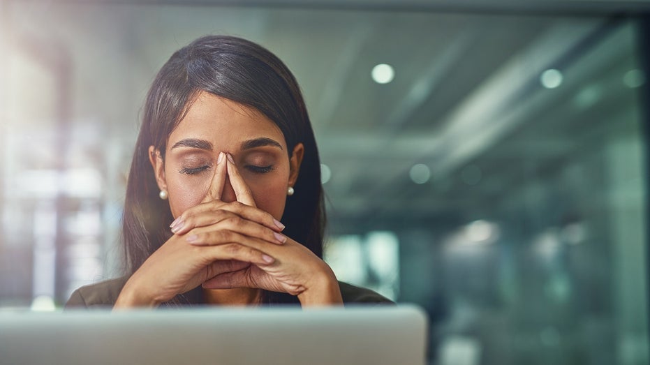 professional woman stressed at computer