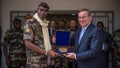 FILE: 14 April 2023, Mali, Bamako: Boris Pistorius (r, SPD), Minister of Defense, stands next to his counterpart, Sadio Camara, Minister of Defense of Mali, with Mali's host gift.