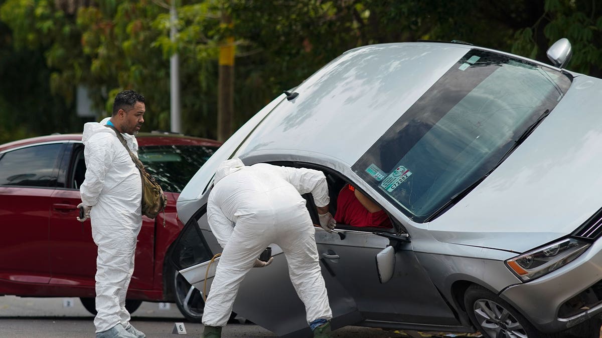 Forensic medical examiners at crime scene