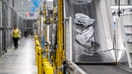 Packages on a conveyer belt at an Amazon fulfillment center on Prime Day in Melville, New York, on Tuesday, July 11, 2023. 