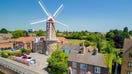 House-hunters are being given the chance to live in a unique three bedroom home after one of Britain&apos;s biggest windmills went on the market for &pound;650,000. See SWNS story SWLNwindmill.  The Maud Foster Windmill is over 200-years-old and dominates the skyline over the Lincolnshire market town of Boston.  Standing at over 80ft (24m) tall, the seven-storey, five-sail windmill is one of the largest operational windmills in the country.   The quirky property has now gone on the market for less than the average price of a London home, according to Zoopla to Rightmove. The historic building sports three roomy bedrooms and two large bathrooms, making it an ideal family home nestled on the river banks of the Maud Foster.Two of the building&apos;s seven storeys are currently home to a shop and a flour business, with a former caf&eacute; located on the first floor.  The windmill was built in 1819 for Isaac and Thomas Reckitt, who ran it up until 1833 when it was forced to close due to several years of poor harvests.  In 1987 the mill was bought by James Waterfield and his family who restored it to full working order and turned it into the &quot;most productive windmill in England.&quot;