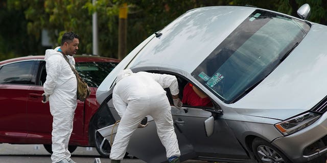 Forensic medical examiners at crime scene