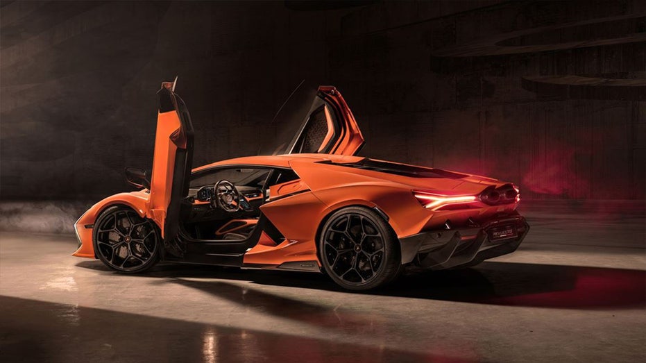 Orange Lamborghini with doors up