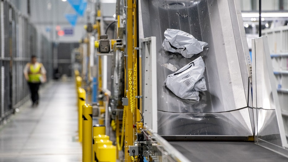 Packages on a conveyer belt at an Amazon fulfillment center in New York