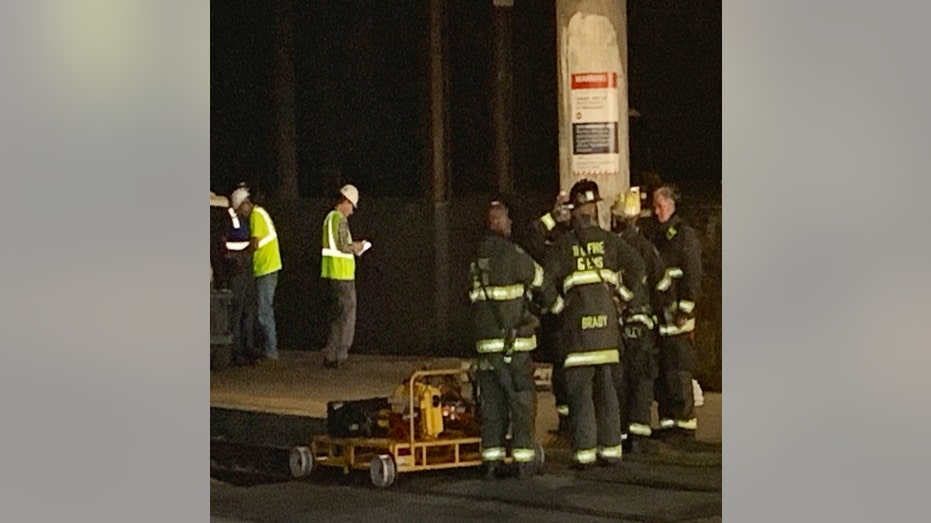 Firefighters and other workers at the impacted tunnel in Washington, D.C.