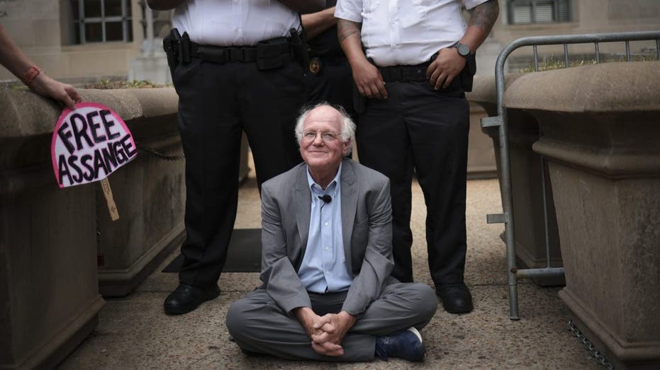 Ben Cohen sitting during protest