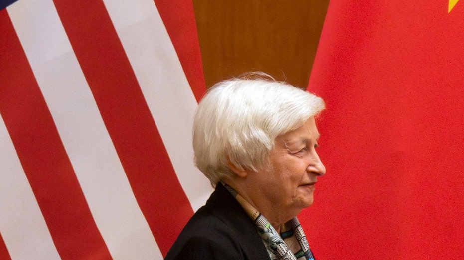 U.S. Treasury Secretary Janet Yellen looks on