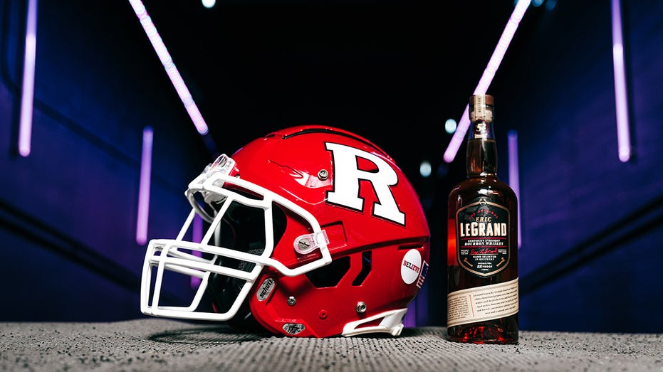 Rutgers Football helmet next to Eric LeGrande Kentucky Straight Bourbon