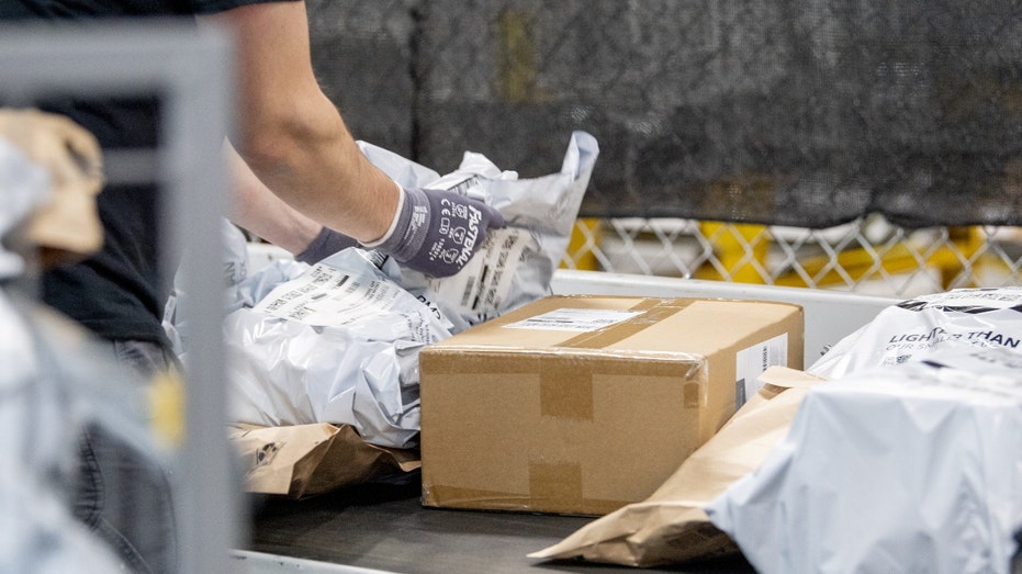 New York workers fulfill orders at an Amazon fulfillment center on Prime Day