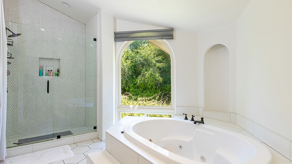 bathroom with large tub