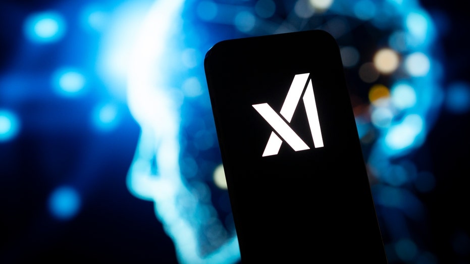 The xAI logo is seen on a mobile device