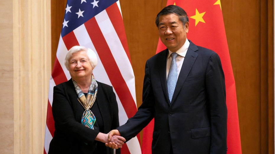 U.S. Treasury Secretary Janet Yellen, left, shakes hands with Chinese Vice Premier He Lifeng