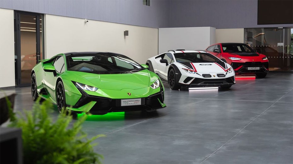 Lamborghinis in a line; green, white and red
