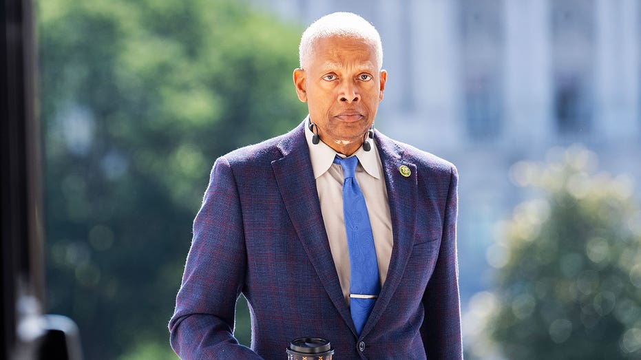 Rep. Hank Johnson wears navy blue suit and royal blue tie