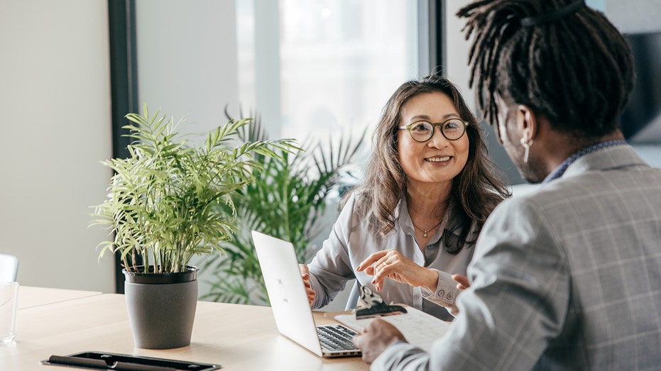 two people at desk