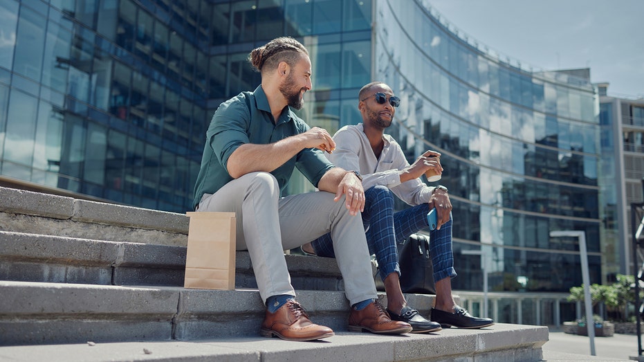 men sitting on steps