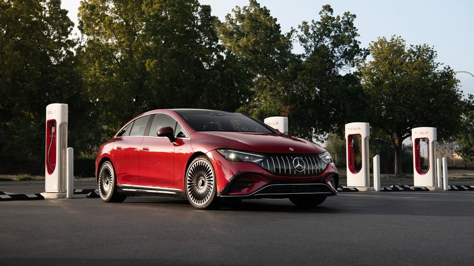 Mercedes parked at Tesla Supercharger station