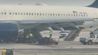 Video shows Delta Air Lines plane deploying emergency slides in Atlanta after tires blow out during landing
