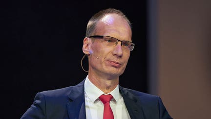 Michael Lohscheller, chief executive officer of VinFast, speaks at the global premiere of the VinFast VF e35 and e36 electric vehicles (EVs) during AutoMobility LA ahead of the Los Angeles Auto Show in Los Angeles, California, U.S., on Wednesday, Nov. 17, 2021. Covid-19 canceled the Los Angeles Auto Show in 2020 and now that the show is back, some automakers have decided they didnt need it anyway. Photographer: Bing Guan/Bloomberg via Getty Images