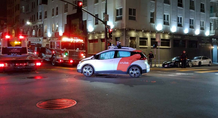 A driverless Cruise sits in the intersection after allegedly colliding with a firetruck