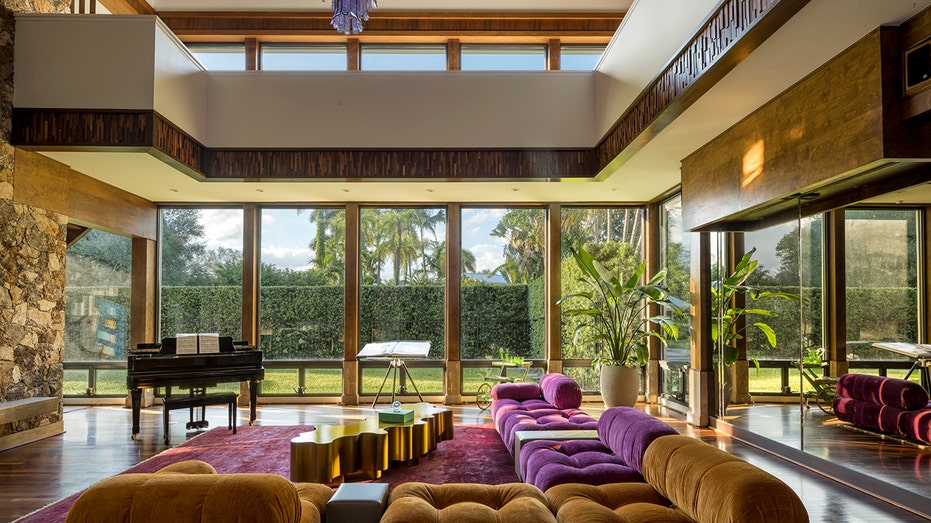 living room with floor to ceiling windows