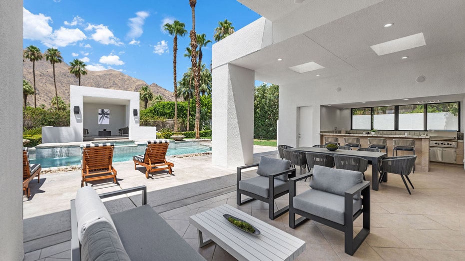 Covered terrace overlooking swimming pool