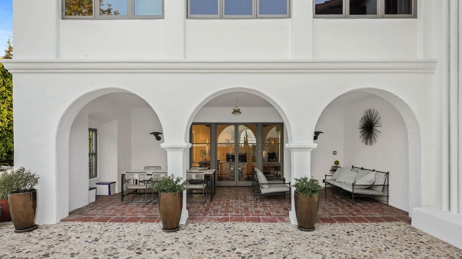 Howard Hughes mansion cobblestone courtyard