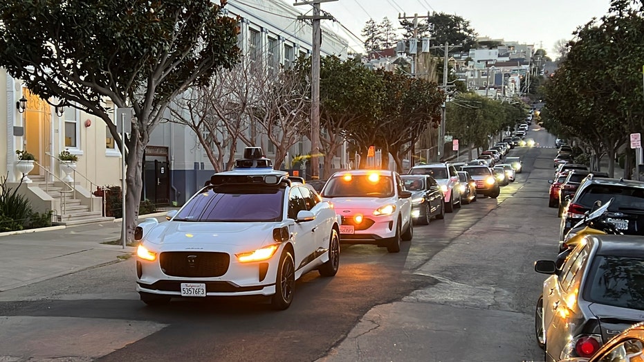 Waymo driverless taxi stops in middle of street