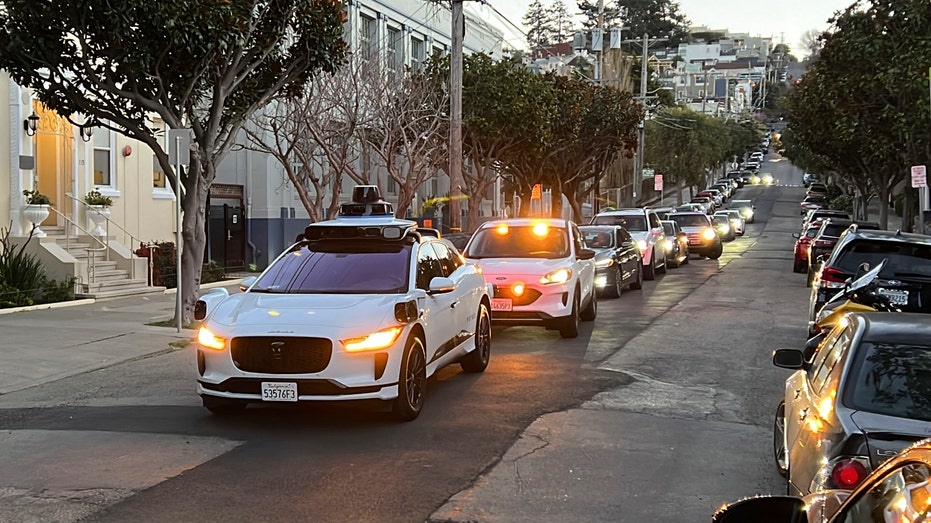 Waymo driverless taxi stops in middle of street