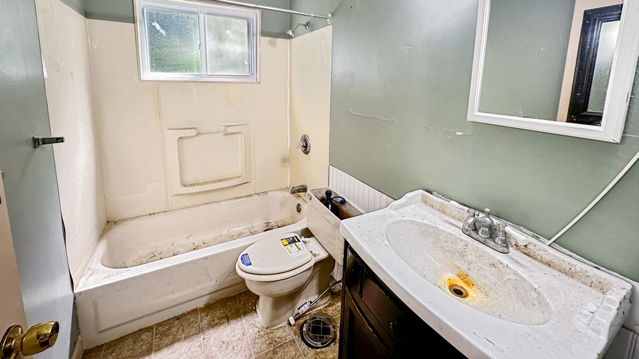 A bathroom is seen in the Michigan home listed for $1