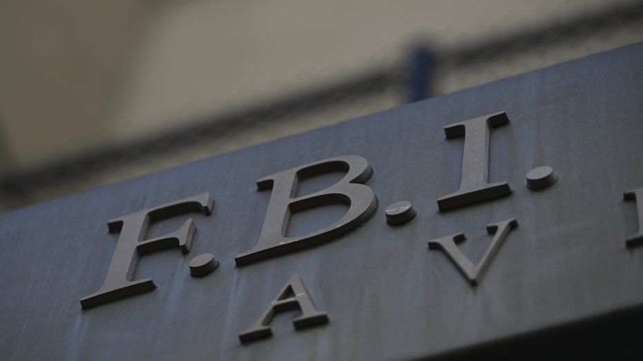 A sign for the FBI at the Federal Bureau of Investigation headquarters building