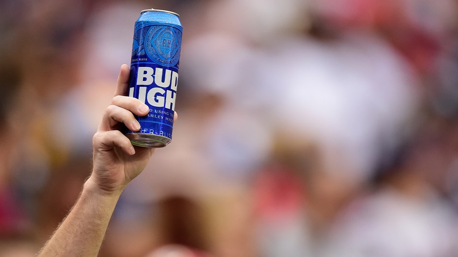 Football fan holds up Bud Light