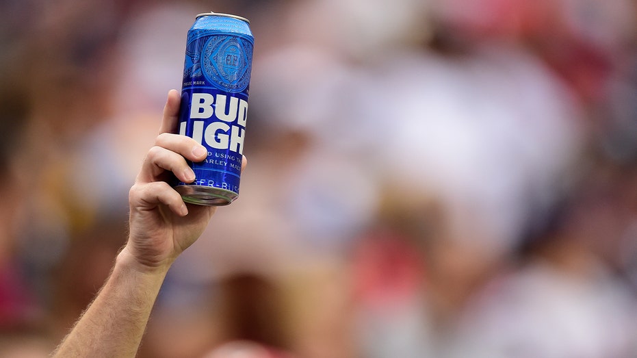 Football fan holds up Bud Light