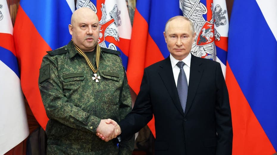 Colonel General Sergei Surovikin, shaking hands with Russian President Vladimir Putin