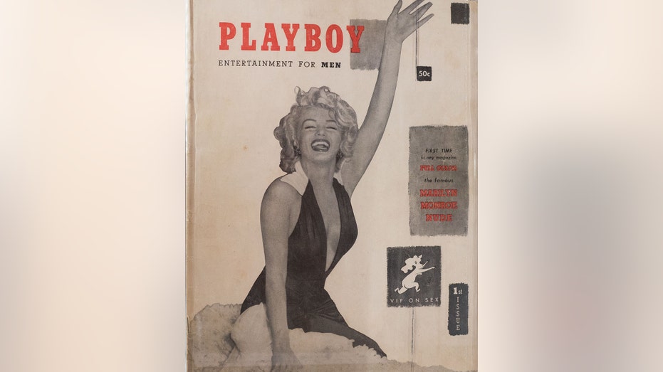 A cover of the first Playboy issue with Marilyn Monroe wearing a low-cut black dress waving