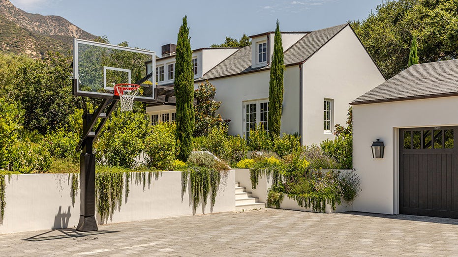an alternate view of the guesthouse with a basketball court