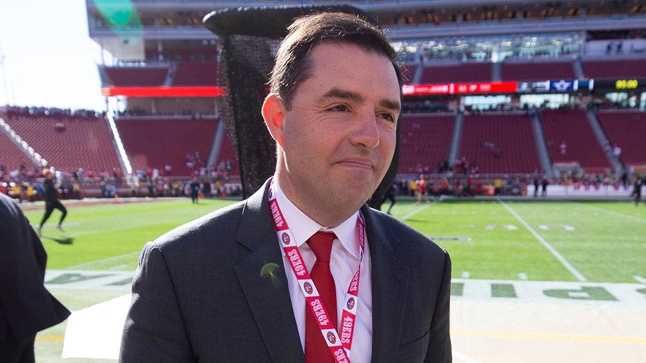 Jed York walks on field