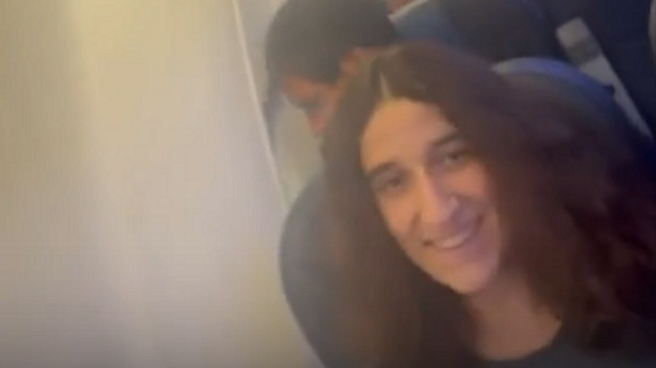 Passenger smiles on plane encountering turbulence in Spain