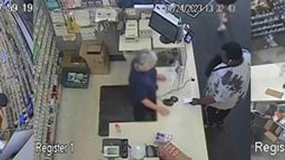 Travon Morgan at a cash register on surveillance camera
