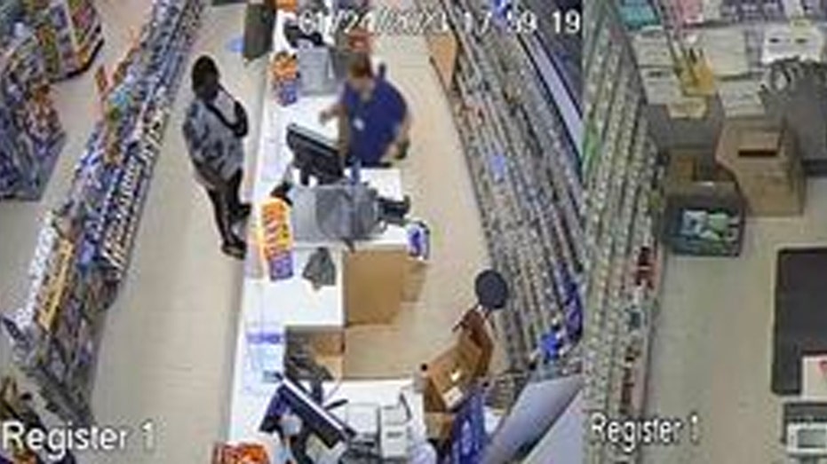Travon Morgan at a cash register on surveillance camera